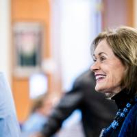 Donna Brooks talking with guests.